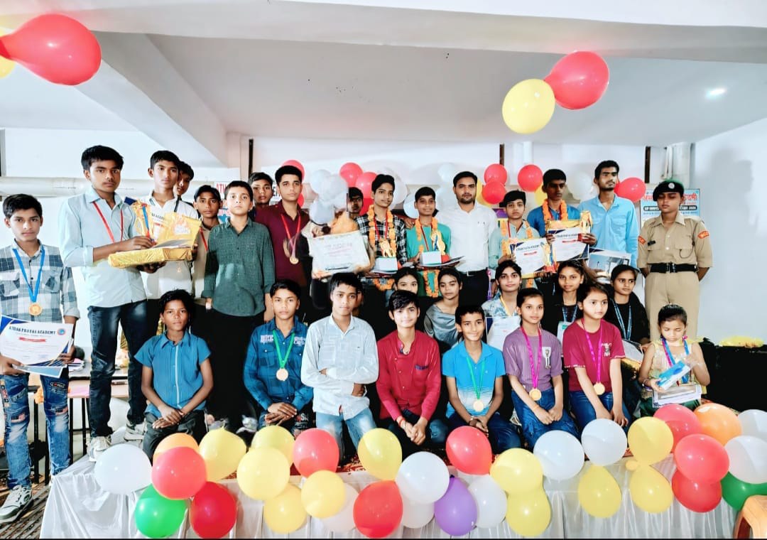 Students gather with certificates and medals at the academy awards ceremony