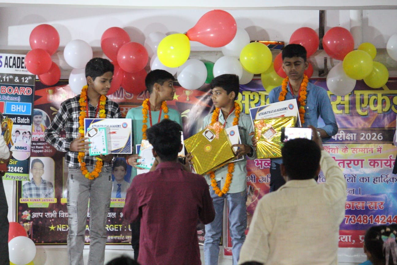 Students receive awards on stage at an academy ceremony
