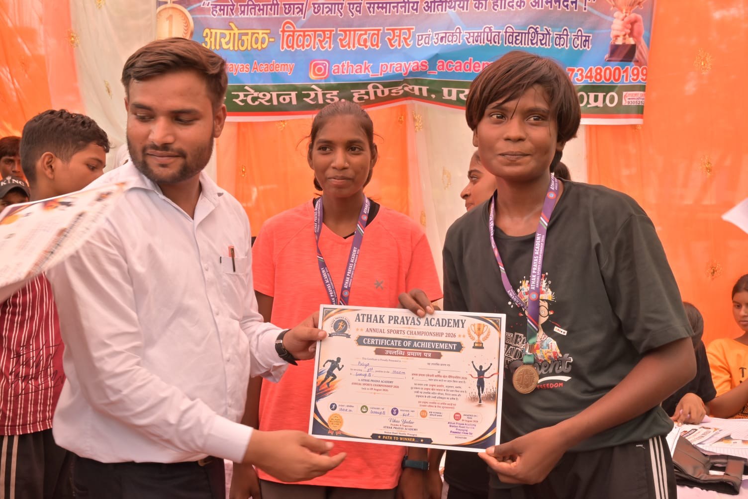 A student receives a sports championship certificate
